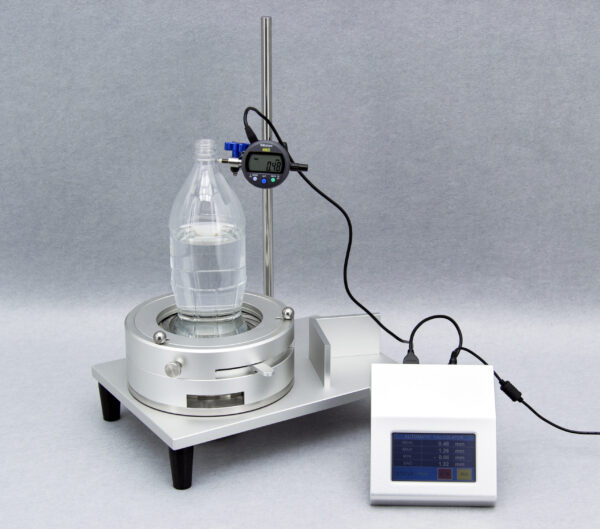 Universal Bottle Perpendicularity Tester model UBPT-1 (with external Automatic Calculator) testing a PET bottle
