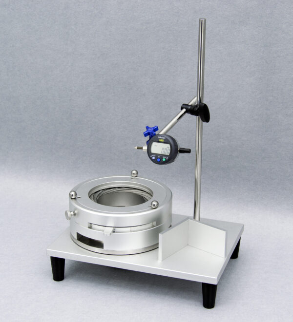 UBPT-1/1S Universal Bottle Perpendicularity Tester measuring a glass bottle