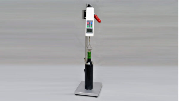 CET Cork Extraction Tester measuring cork insertion and extraction forces in a wine bottle