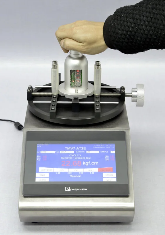 Hand operates torque tester for electronic component.